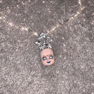 Handmade doll head necklace